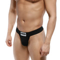 Black men’s briefs MetroMaleWear Deseo thong black with white logo patch on waistband front view