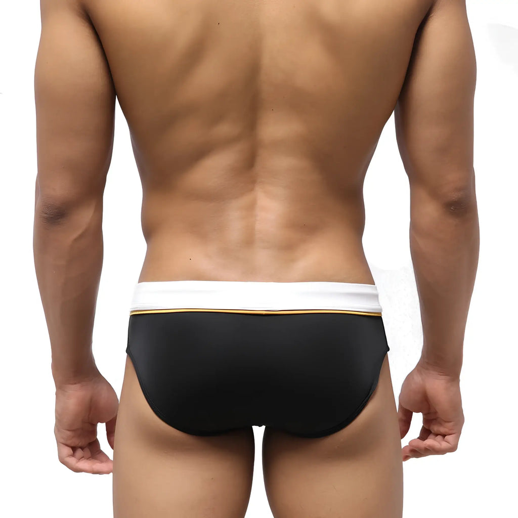 MetroMaleWear edge swim brief black with white waistband and thin gold trim designed for swimming and beachwear