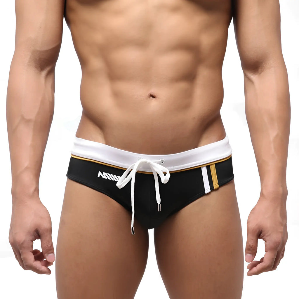 MetroMaleWear Edge swim brief black with white waistband gold trim and white drawstring for swimming and beachwear