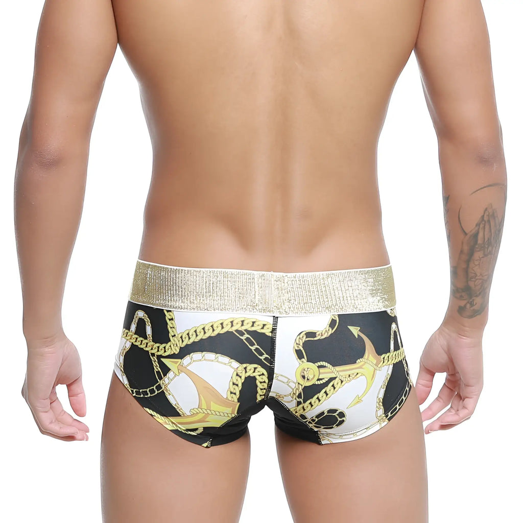 Black and white swim trunks with bold gold anchor and chain pattern and metallic waistband by Metromalewear Egyptian Trunk 7013-99
