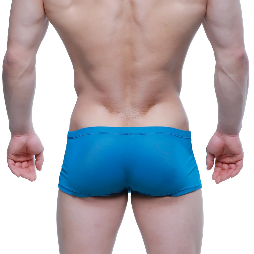 Bright blue form-fitting metroMaleWear enhancement boxer swim trunks made of smooth stretchy fabric