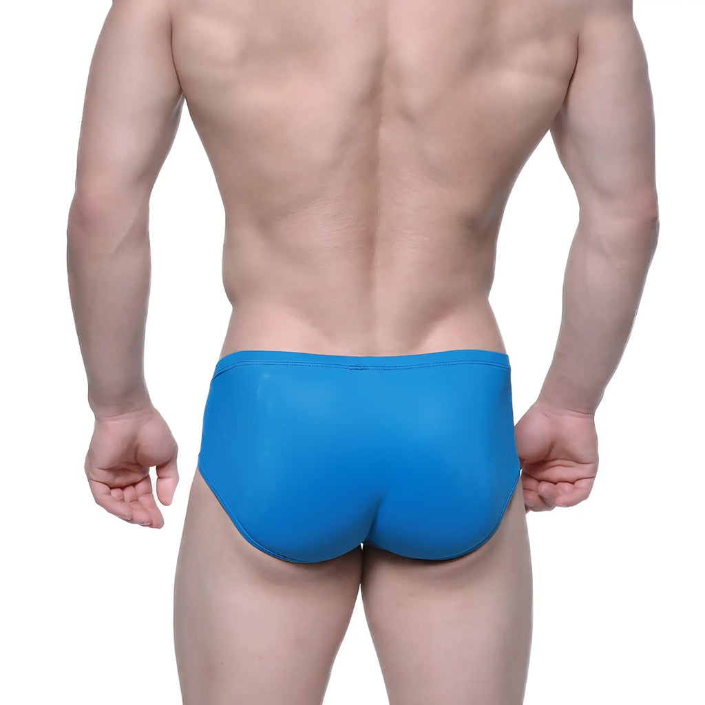 Bright blue metroMalewear Entropy bikini petrol swim trunks with a smooth glossy finish and form-fitting design
