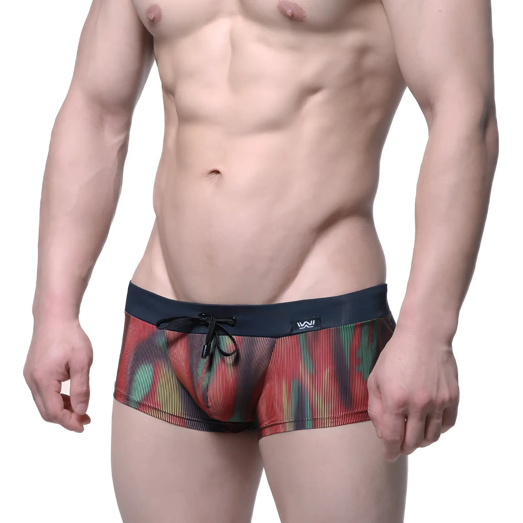 MetroMaleWear fire swim boxer briefs with vibrant red green yellow abstract pattern on sheer mesh and navy waistband