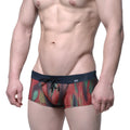 MetroMaleWear fire swim boxer briefs with vibrant red green yellow abstract pattern on sheer mesh and navy waistband