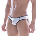 White mesh fishnet briefs with black trim and a red logo on the waistband from metromalewear