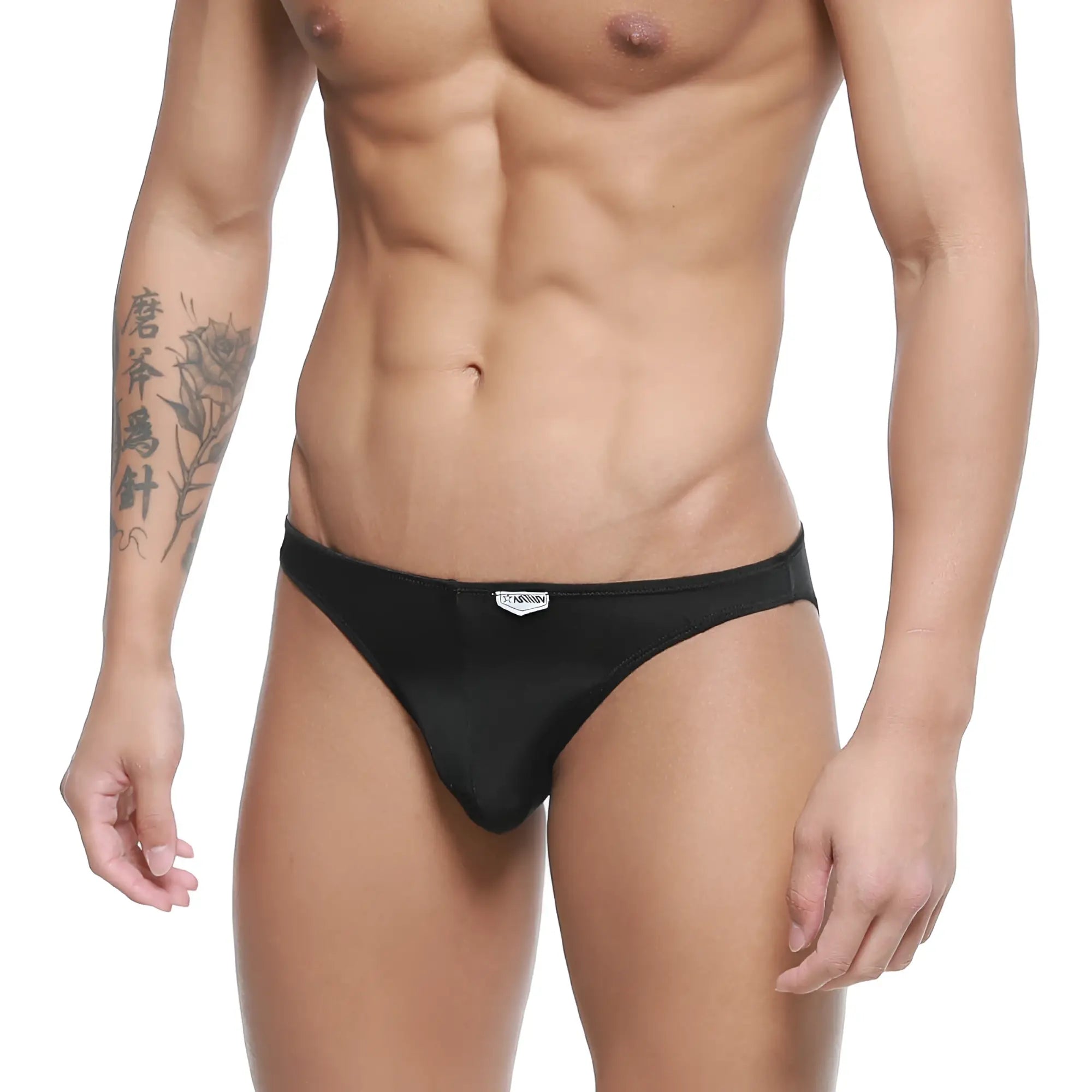 Black sleek form-fitting men’s briefs with subtle MetroMaleWear brand tag at waistband for comfortable daily wear