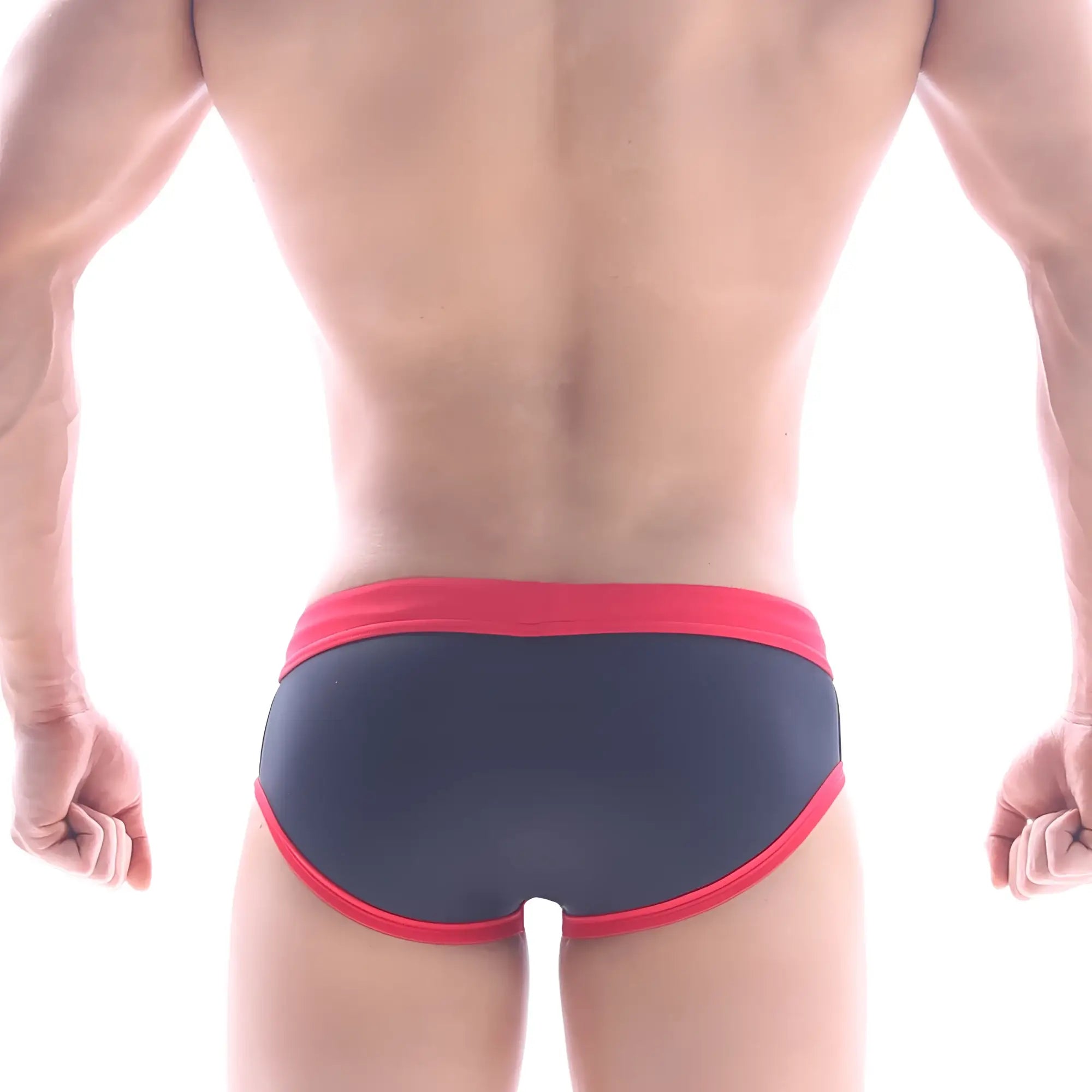Dark blue metro male wear frame swim brief with bold red trim on waistband and leg openings for swimwear use