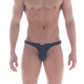 Navy blue MetroMaleWear Fria thong featuring a small red and white brand tag at the waistband