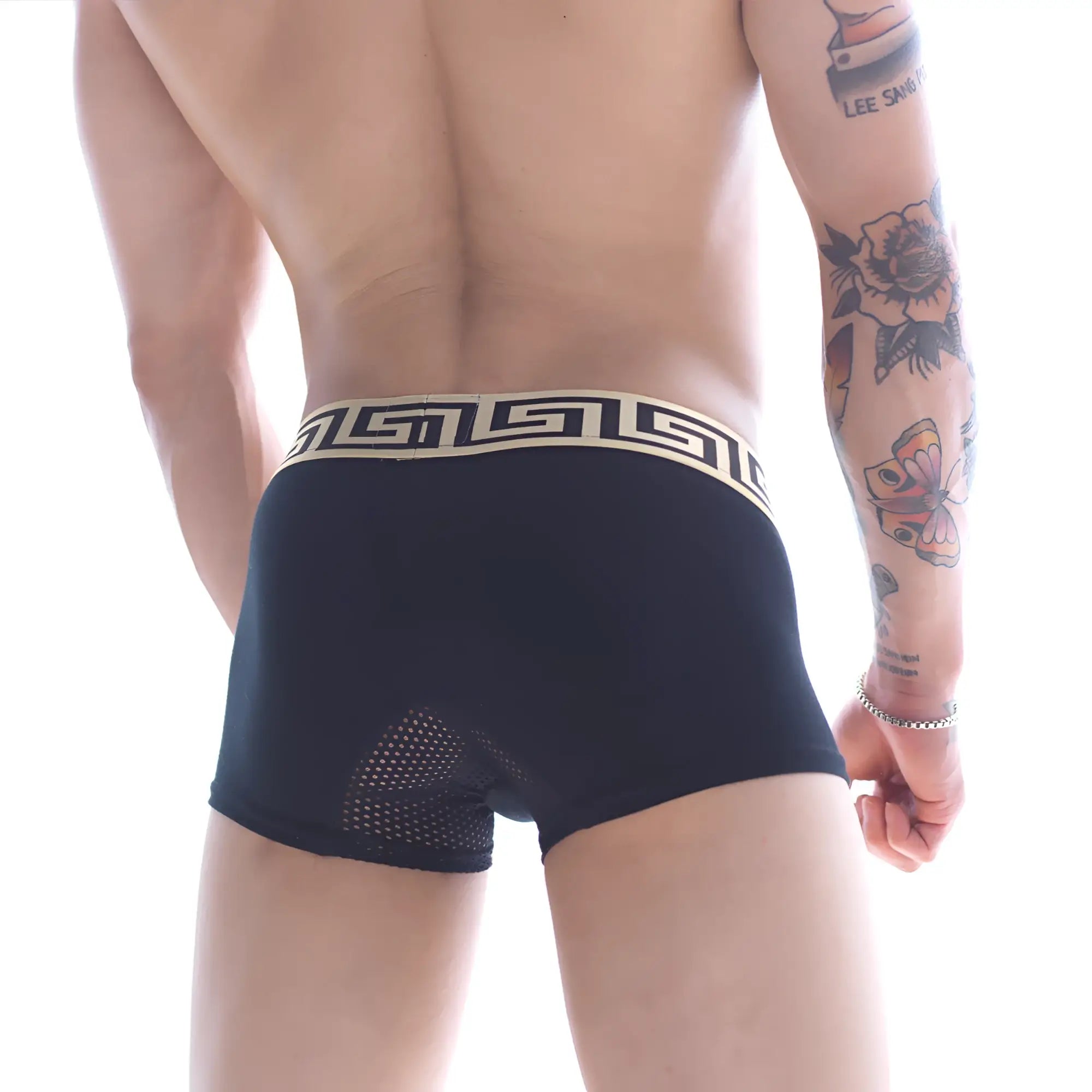 Back view of metroMaleWear grid short boxer black 7 inch with cream greek key waistband and mesh paneling