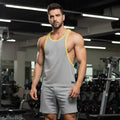 MetroMaleWear gym tank top grey with yellow trim and small black logo on lower left side for athletic use