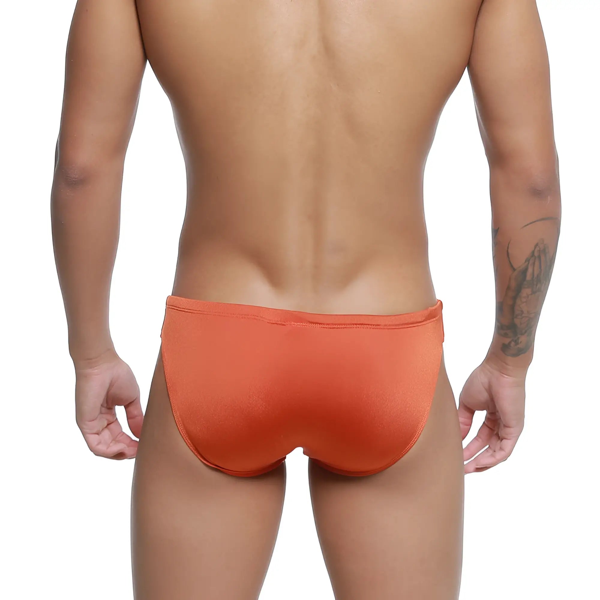 Orange MetroMaleWear Hunter swim brief in ochre features smooth, form-fitting fabric with a snug waistband