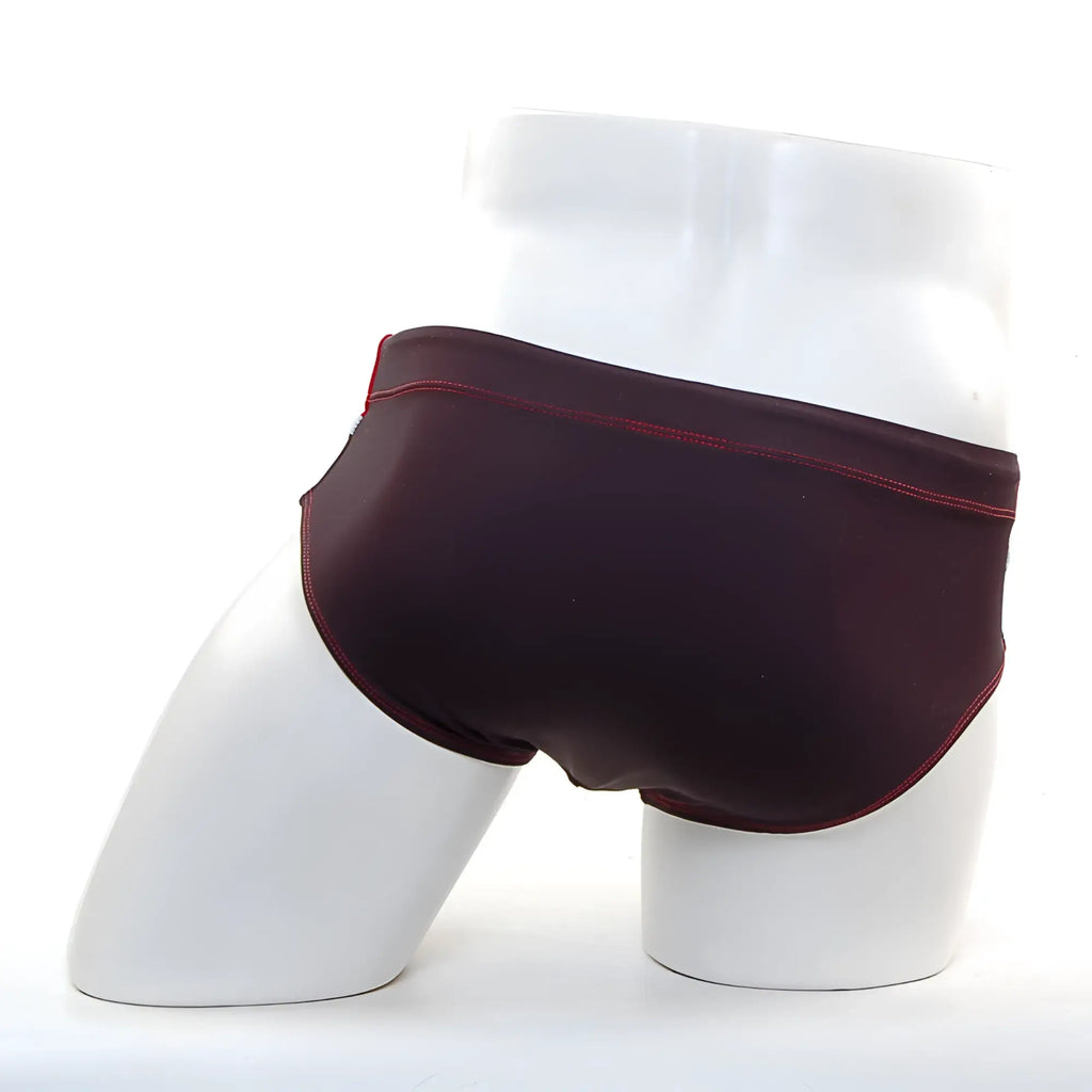 MetroMaleWear Ibiza swim brief in dark burgundy with contrasting red stitching on waistband and leg openings