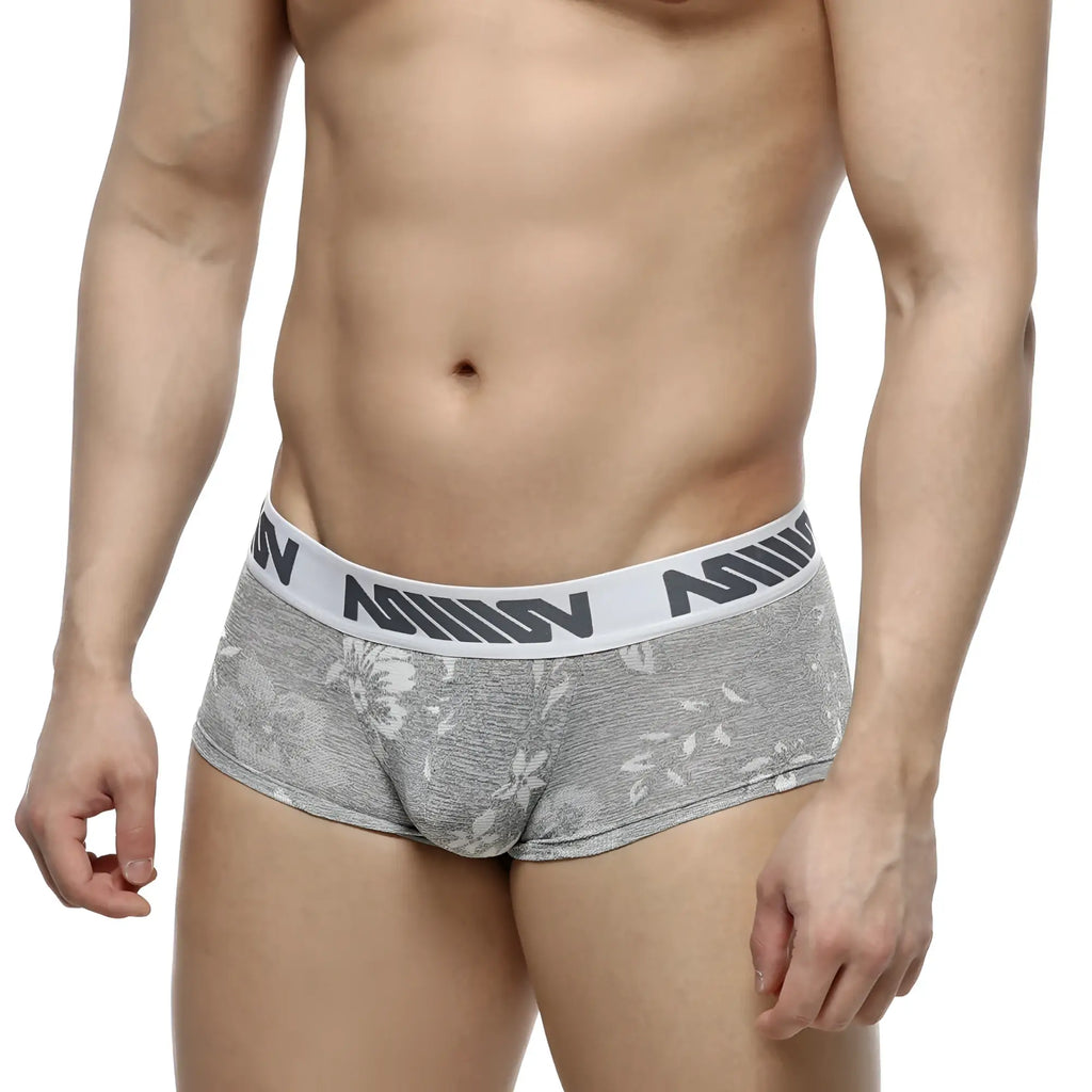 Gray floral-patterned jacquard briefs with white elastic waistband and black nomin lettering by MetroMaleWear