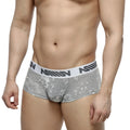 Gray floral-patterned jacquard briefs with white elastic waistband and black nomin lettering by MetroMaleWear
