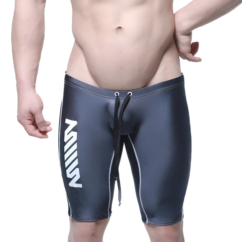 Dark gray form-fitting metroMalewear jammer swim boxer with white vertical branding and contrasting stitching