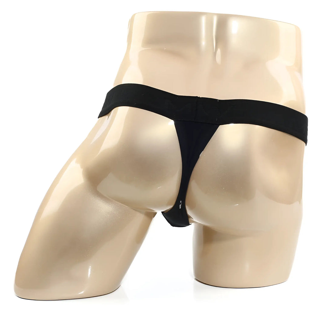 MetroMaleWear kiss black thong with smooth elastic waistband and thin fabric straps shown from the back side