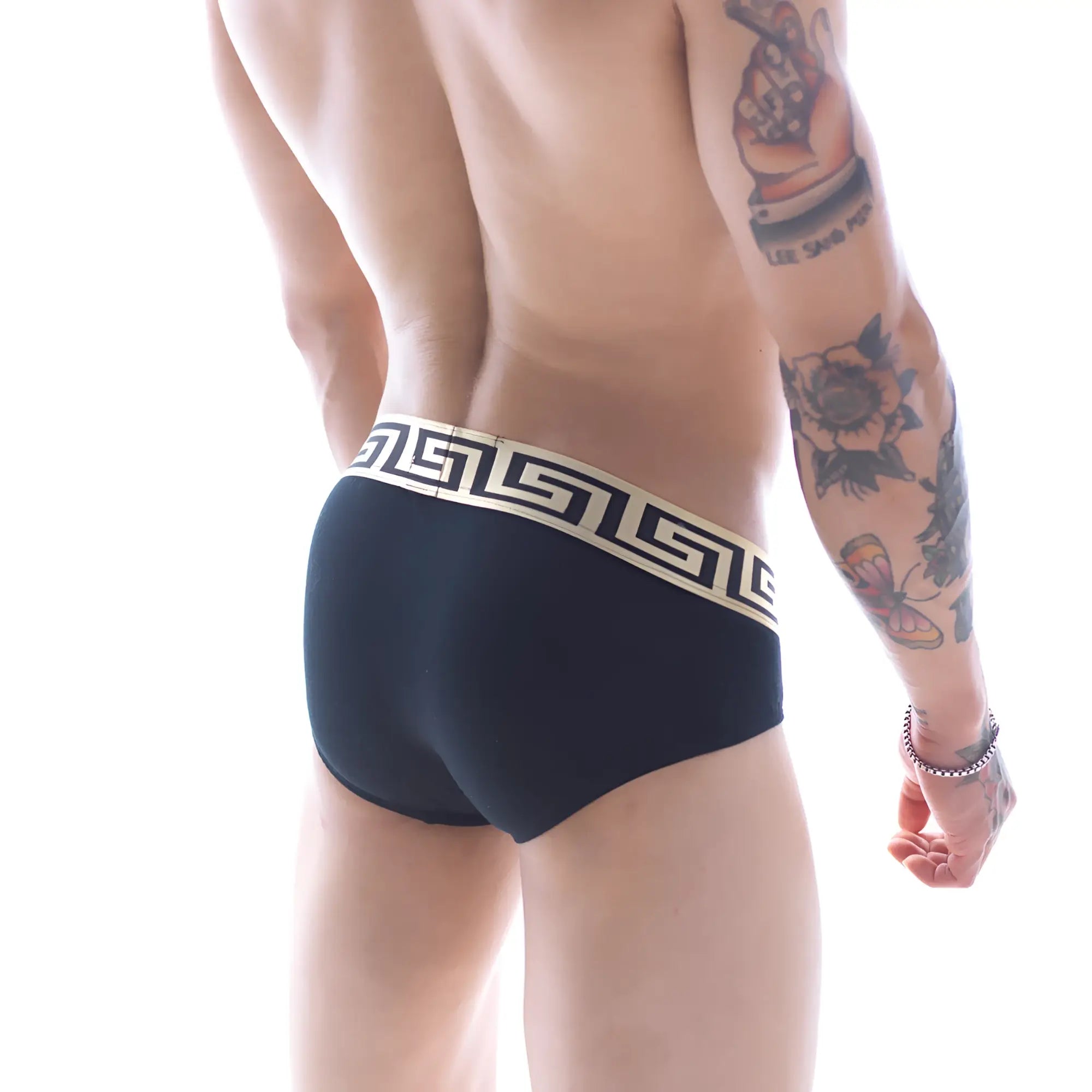 Black briefs with a cream-colored greek key patterned waistband from metromalewear limited edition grid hip brief 5003-75