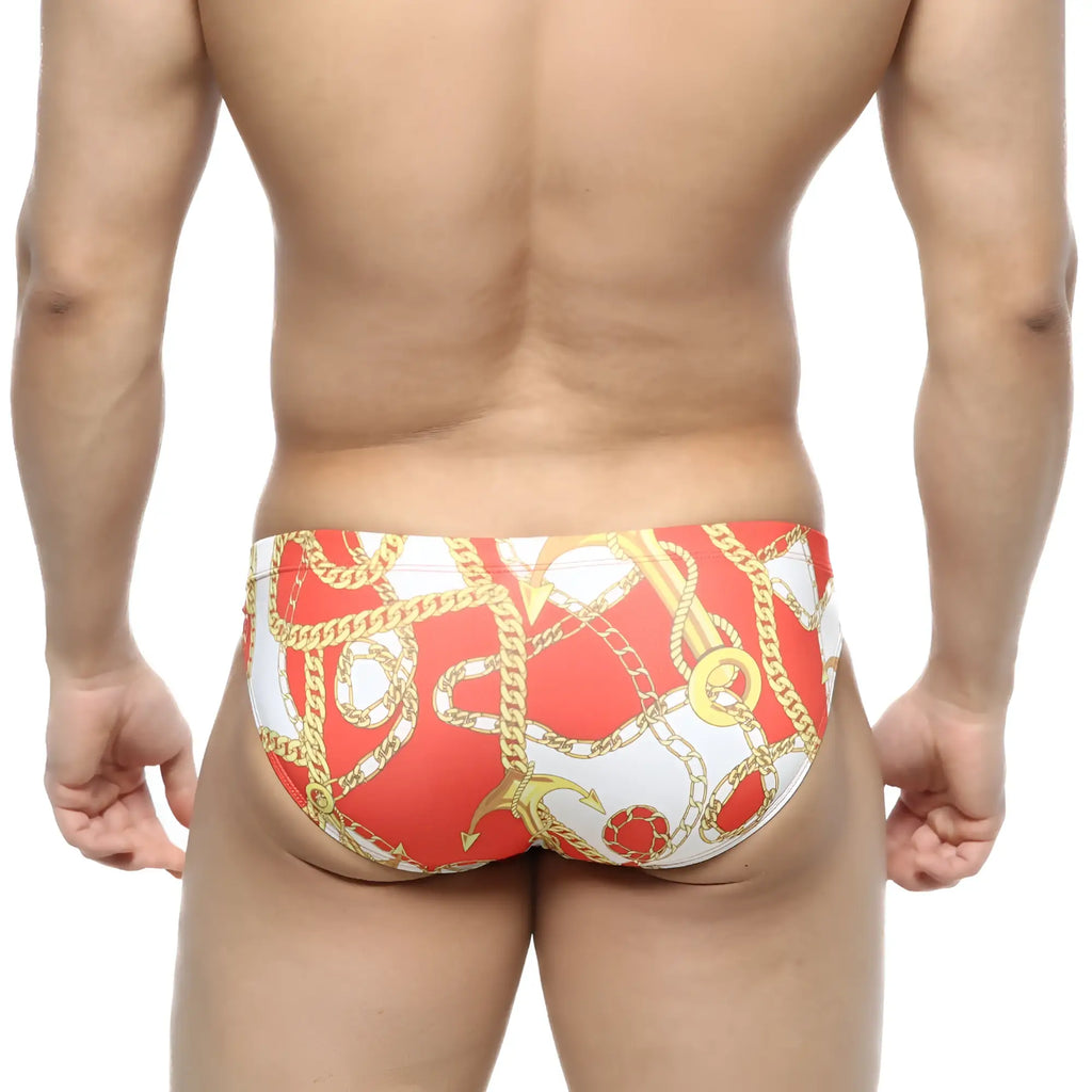 MetroMaleWear Lujo bikini red swim trunks feature a red and white bold gold chain and anchor pattern