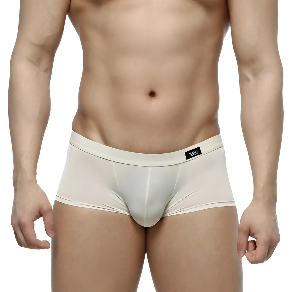 MetroMaleWear Lupin trunk 2026-05 cream-colored form-fitting men’s briefs with smooth stretchy fabric and black logo patch