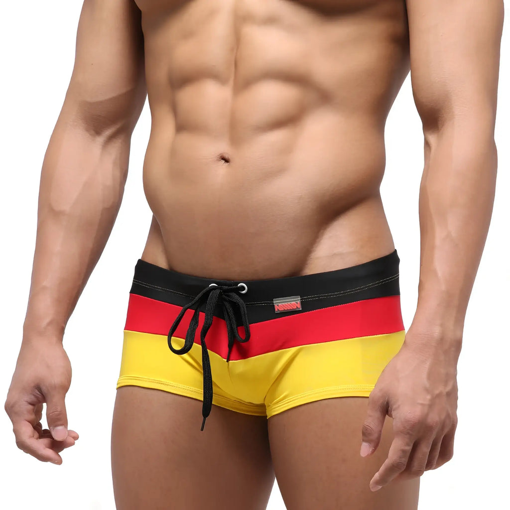 MetroMalewear lycos swim trunk yellow 4938-15 features germany-themed bold black red and yellow striped trunks with drawstring waistband