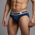 Navy blue MetroMaleWear M25 hip briefs with white elastic waistband featuring black million branding