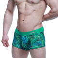 Green tropical leaf patterned boxer briefs with solid green waistband featuring minny logo by metromalewear