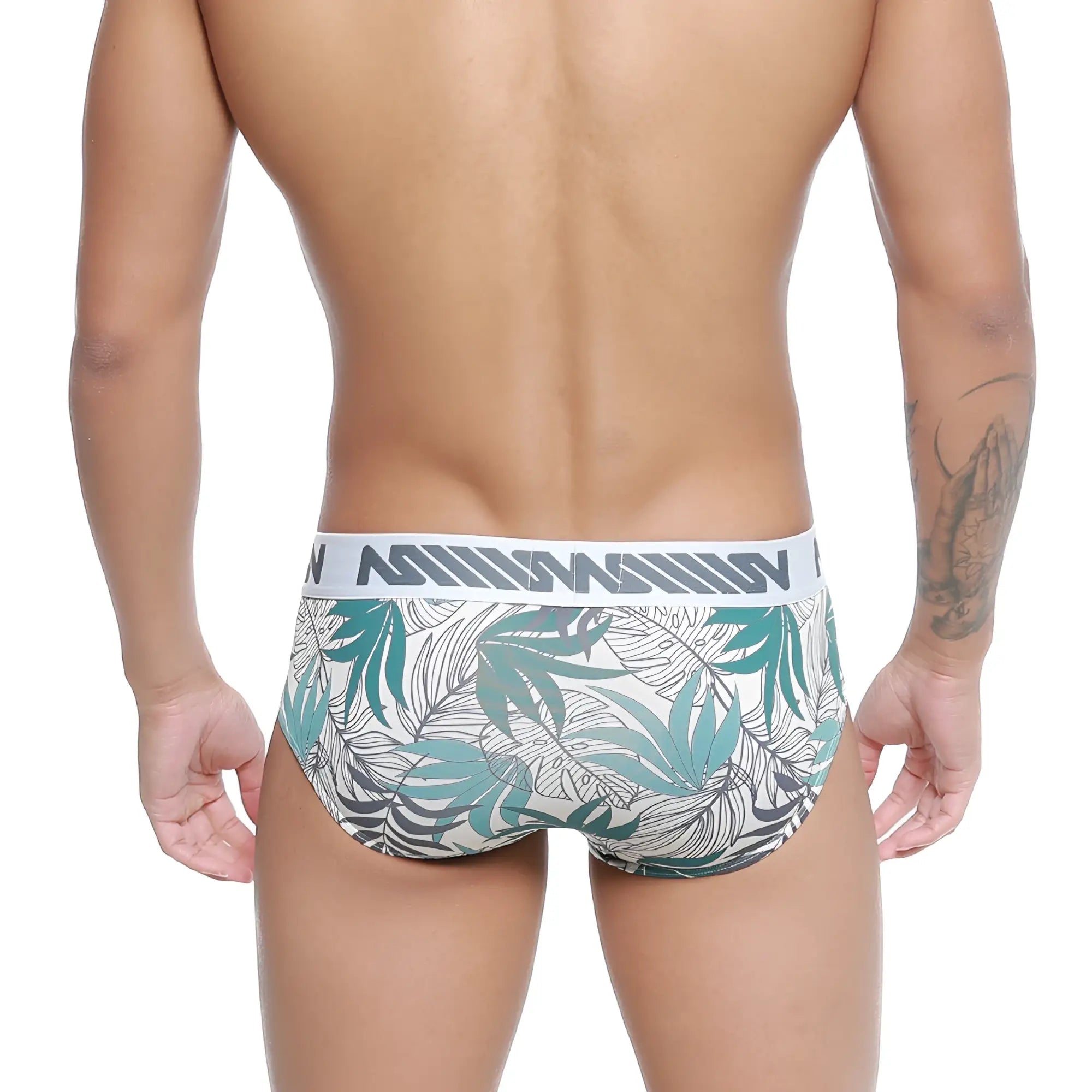 White briefs with teal and gray tropical leaf pattern and metromalewear branded elastic waistband metro male meadow hip brief