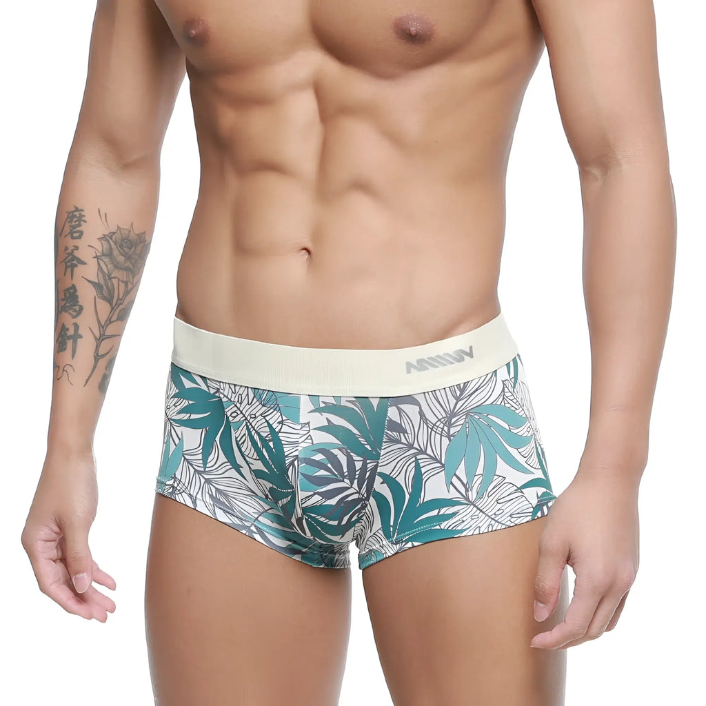 White briefs metroMalewear meadow trunk 2026-66 with vibrant teal and gray tropical leaf pattern and elastic waistband