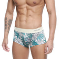 White briefs metroMalewear meadow trunk 2026-66 with vibrant teal and gray tropical leaf pattern and elastic waistband