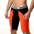 Black and orange MetroMaleWear mesh long shorts with white waistband featuring million brand name in bold black lettering