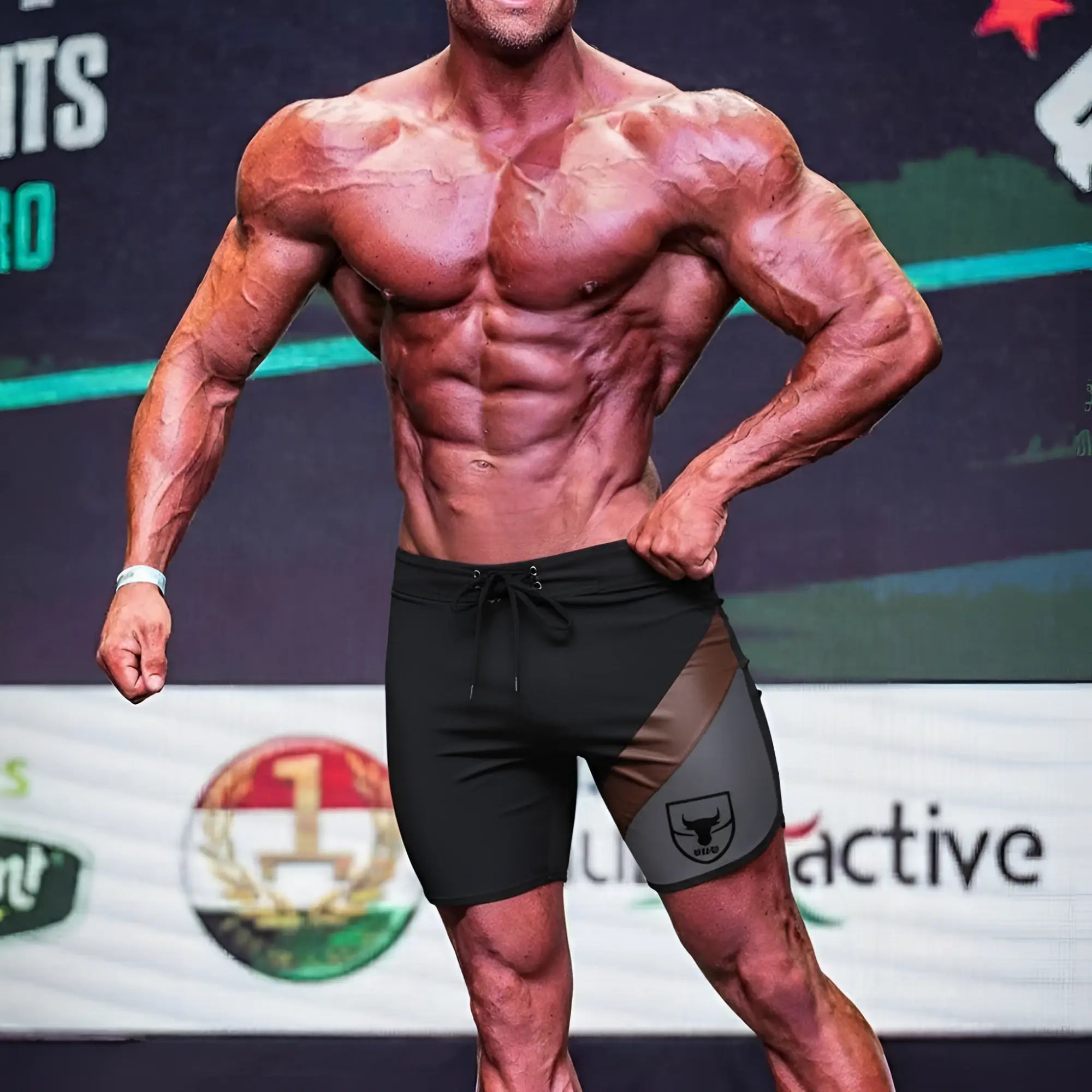 Black and gray MetroMaleWear MetroMuscleWear cafe physique board short with bold bull logo on the side for athletic use