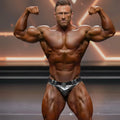 Shiny silver metallic briefs with decorative buckle and belt from metromalewear metromusclewear competition suit platinum