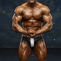 Black and white mesh briefs with a silver-toned diamond-patterned panel from MetroMaleWear MetroMuscleWear competition suit