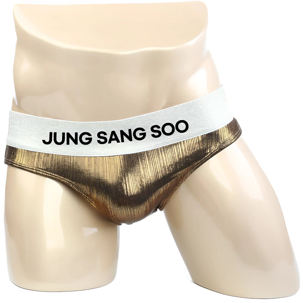 Gold metallic textured briefs with white elastic waistband featuring jung sang soo text from metromalewear metromusclewear