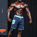 Navy blue MetroMaleWear MetroMuscleWear Marine physique board shorts with light teal trim side pocket and drawstring waistband