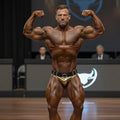 Gold and black MetroMaleWear MetroMuscleWear muscle trunk briefs with metallic buckle for bodybuilding essentials