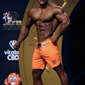 MetroMaleWear MetroMuscleWear orange physique board short with black drawstring and shield logo on lower right leg