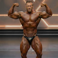 Black leather briefs with gold emblem and metal rings from metro malewear tonys competition suit 4974-14