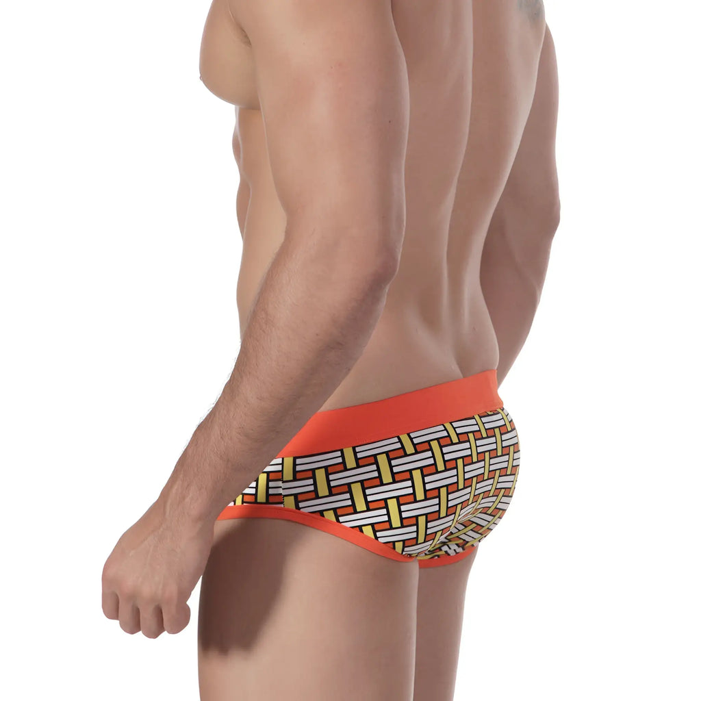 Metro malewear orange colander swim brief with orange trim and geometric basketweave pattern in white yellow and black