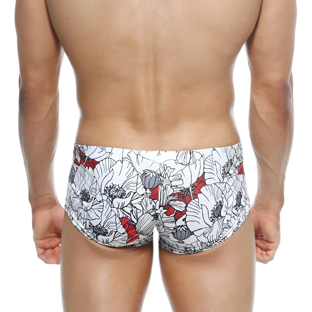 White swim trunks metroMalewear oscar boxer escobar 2125-09 with bold floral pattern black outlines and red accents