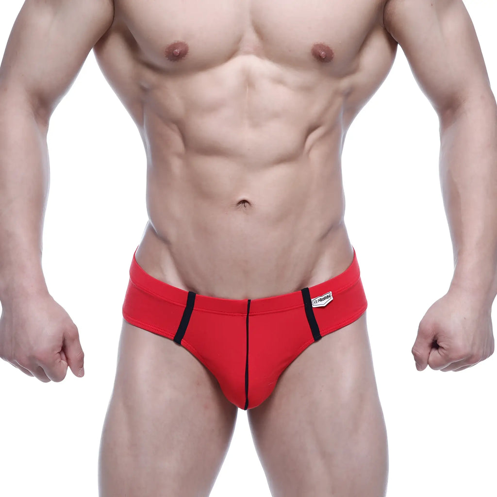 Red athletic briefs with black side stripes and white brand tag on waistband from MetroMaleWear Oslo Thong 5102-12