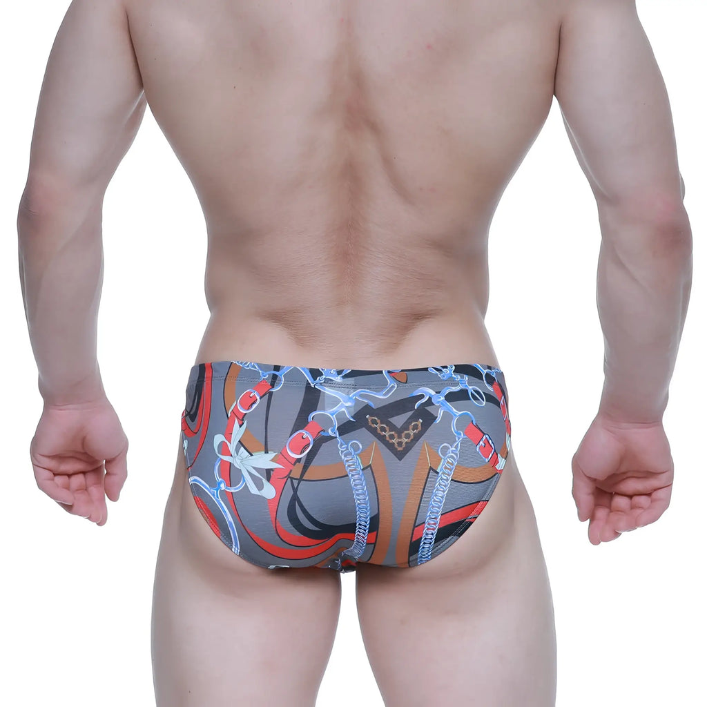 Gray swim trunks from metromalewear padu bikini 5103-m34 with bold red orange and blue chain pattern and decorative bows