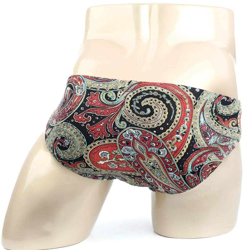 Vibrant red gold and teal paisley-patterned metro malewear paisley bikini 5103-99 men’s briefs on a mannequin