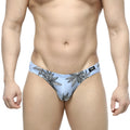 Light blue metro malewear palma bikini briefs with black leaf pattern and small logo on waistband