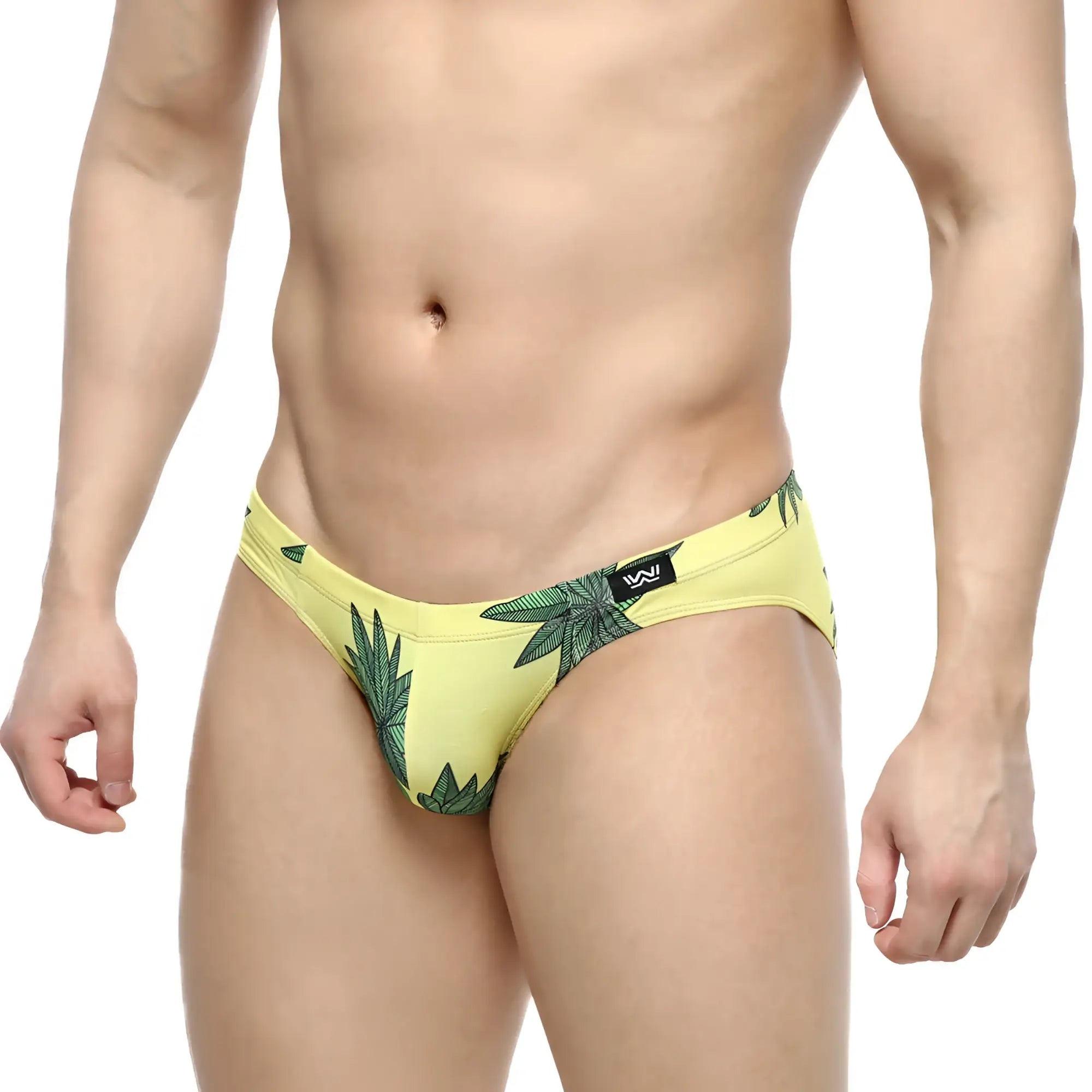 Yellow swim trunks with green leaf pattern and black logo on waistband from MetroMaleWear Palmera Bikini 5103-37