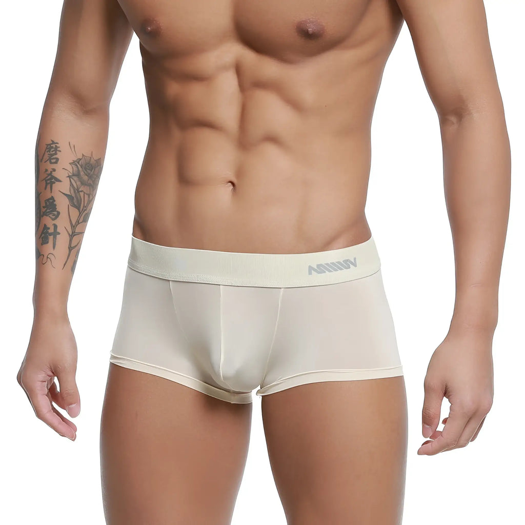 Cream-colored form-fitting men’s boxer briefs with a subtle gray logo on the waistband from MetroMaleWear