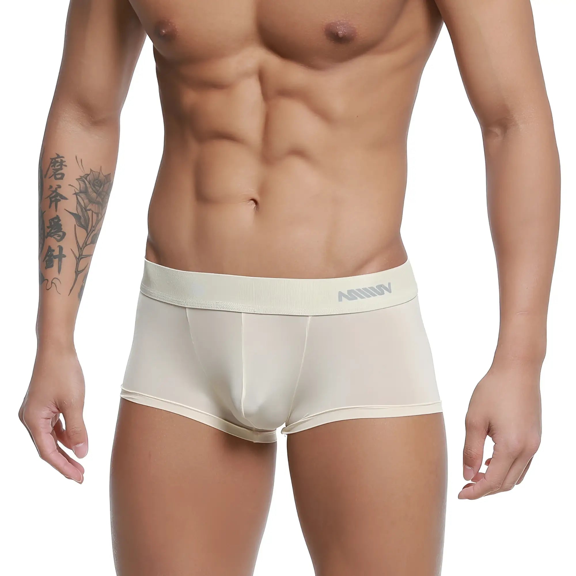 Cream-colored form-fitting men’s boxer briefs with a subtle gray logo on the waistband from MetroMaleWear
