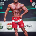 Red metro male wear physique board shorts with white stripes and a bull logo on the left leg for athletic use
