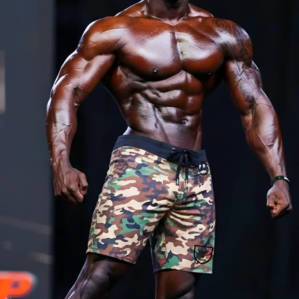 MetroMalewear physique board short green camo with black drawstring waistband and logo patch on lower right leg
