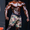 MetroMalewear physique board short green camo with black drawstring waistband and logo patch on lower right leg